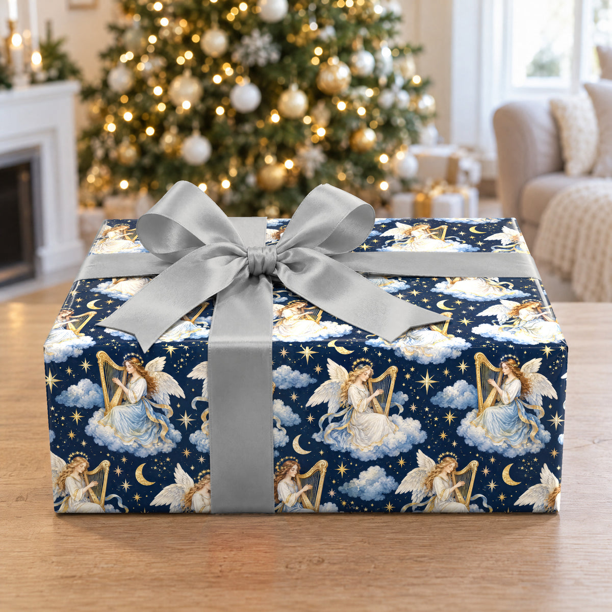 A gift wrapped in Angel Harp Starlight Wrapping Paper in front of a Christmas tree