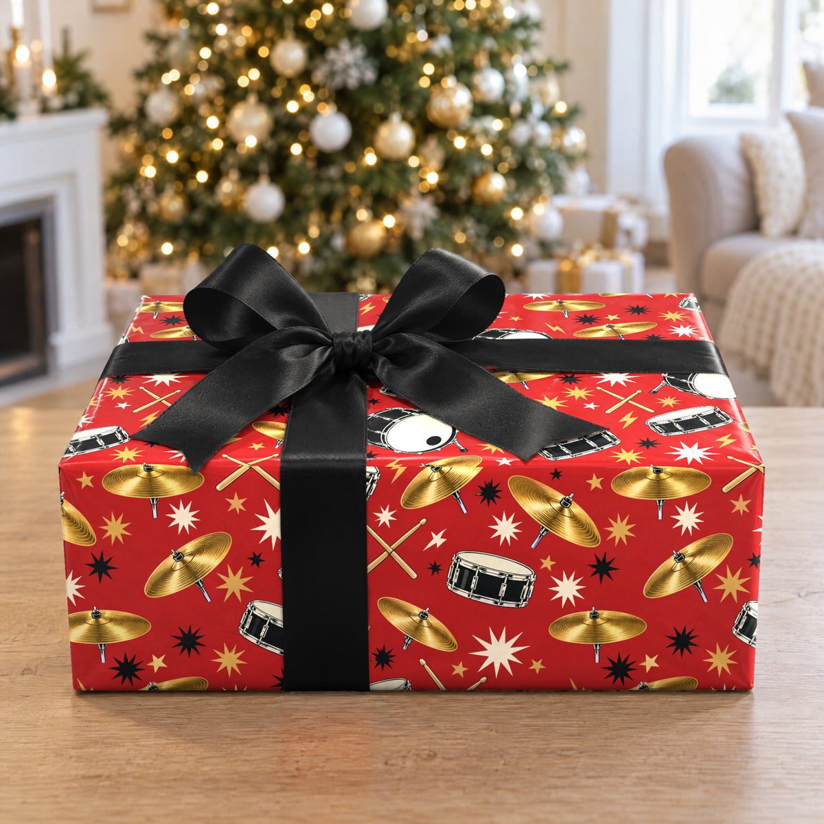 A gift wrapped in Drummer Wrapping Paper in front of a Christmas tree
