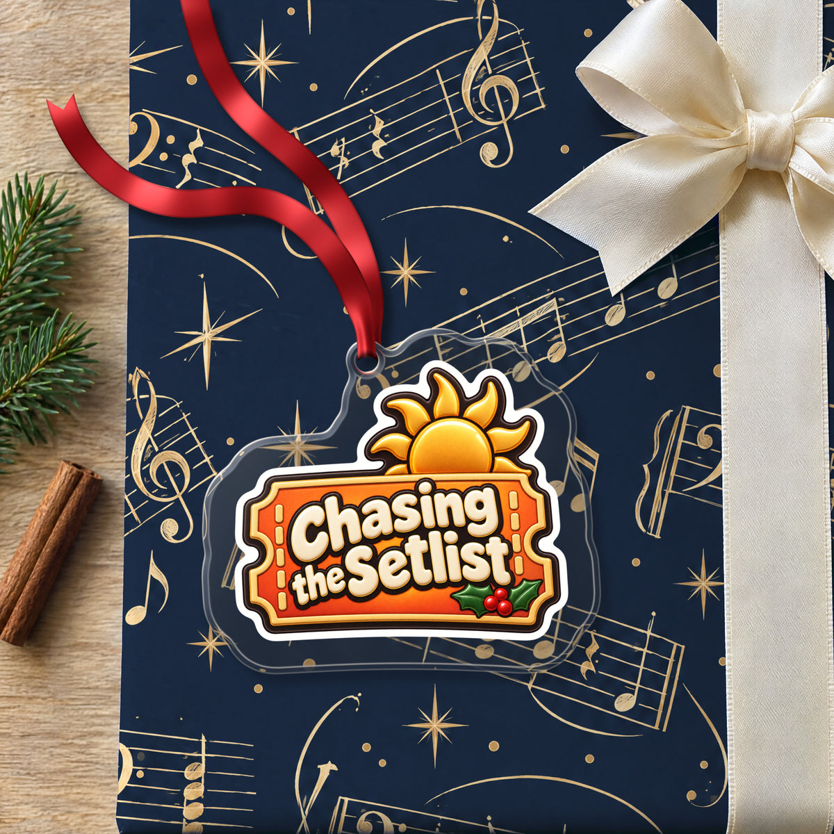 Chasing the Setlist Festival Ticket clear acrylic Christmas ornament lying on a gift wrapped in Rhythm and Beat music wrapping paper