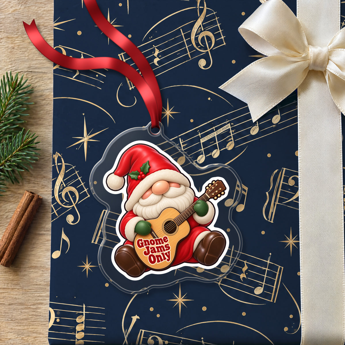 Gnome Jams Only Guitar Gnome clear acrylic Christmas ornament lying on a gift wrapped in Rhythm and Beat music wrapping paper