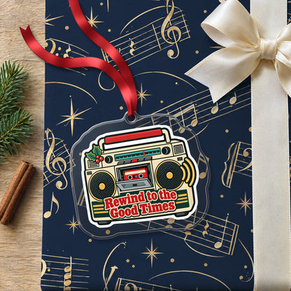 Rewind to the Good Times Boombox clear acrylic Christmas ornament lying on a gift wrapped in Rhythm and Beat music wrapping paper