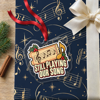 Still Playing Our Song Concert Ticket clear acrylic Christmas ornament lying on a gift wrapped in Rhythm and Beat music wrapping paper