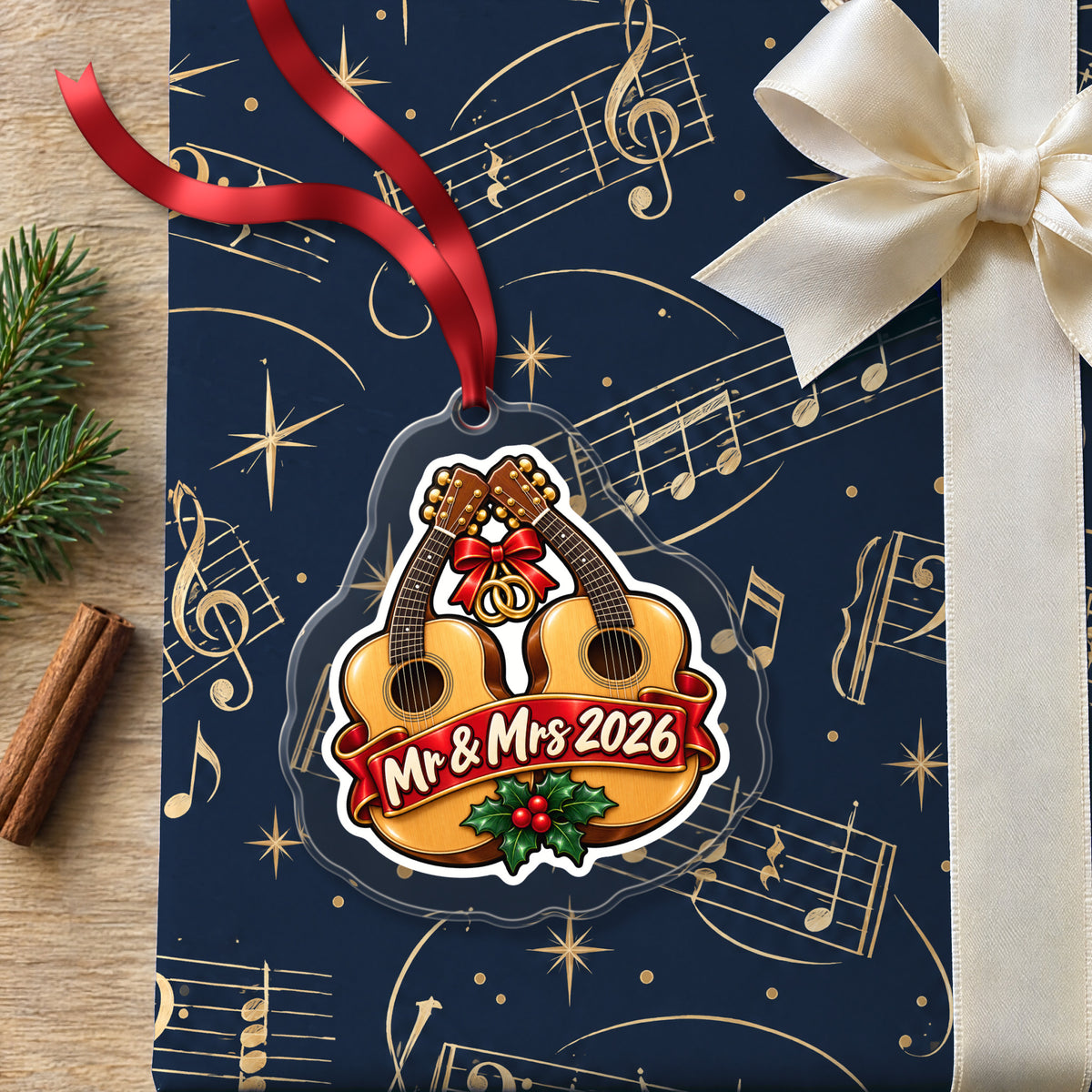 Mr & Mrs First Christmas 2026 Guitar clear acrylic Christmas ornament lying on a gift wrapped in Rhythm and Beat music wrapping paper