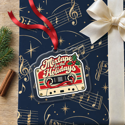 Mixtape for the Holidays Cassette clear acrylic Christmas ornament lying on a gift wrapped in Rhythm and Beat music wrapping paper