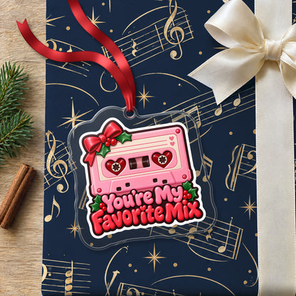 You're My Favorite Mix Cassette clear acrylic Christmas ornament lying on a gift wrapped in Rhythm and Beat music wrapping paper