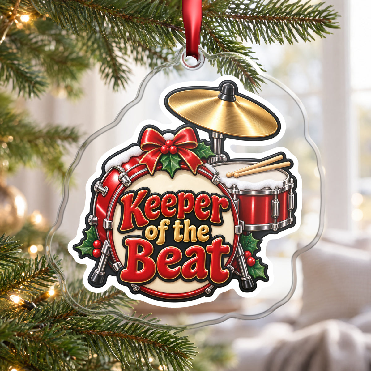 Keeper of the Beat Drum Kit clear acrylic Christmas ornament hanging on a Christmas tree by a bright window