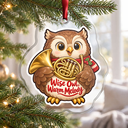 Wise Owl, Warm Melody French Horn clear acrylic Christmas ornament hanging on a Christmas tree by a bright window