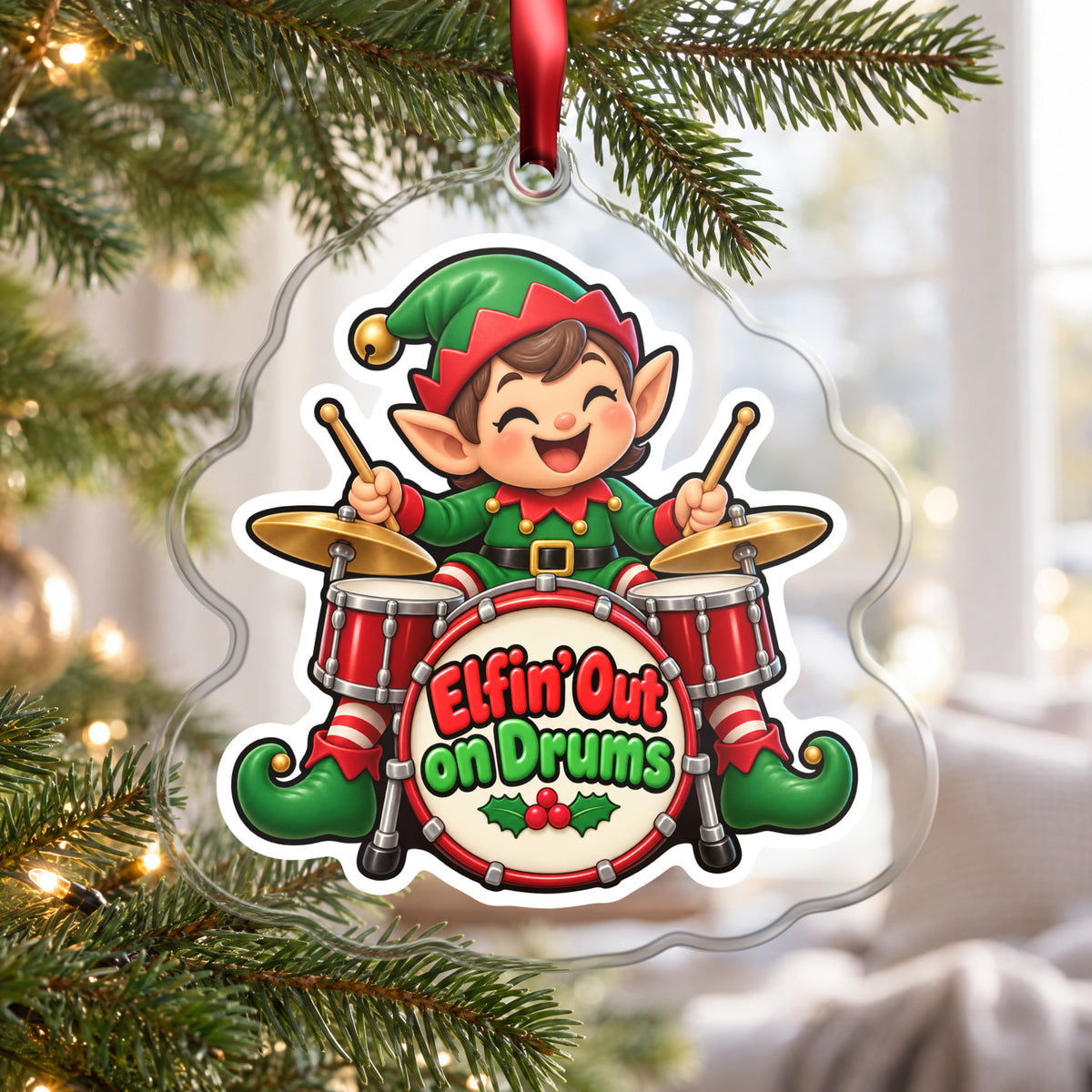 Elfin' Out on Drums Elf Drummer clear acrylic Christmas ornament hanging on a Christmas tree by a bright window