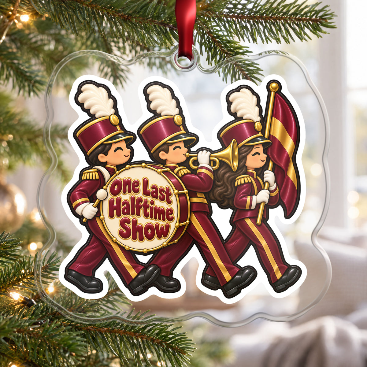 One Last Halftime Show Marching Band clear acrylic Christmas ornament hanging on a Christmas tree by a bright window