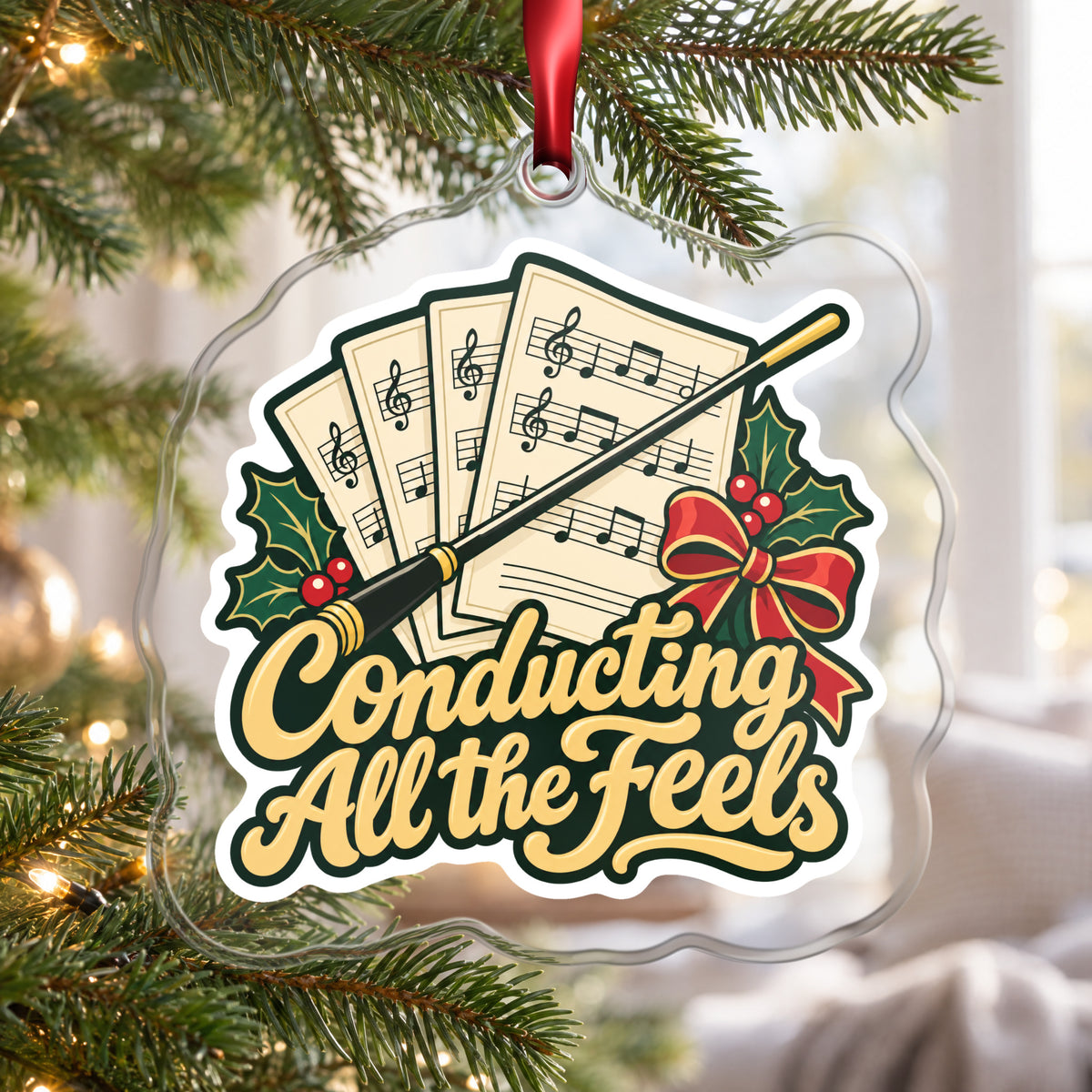 Conducting All the Feels Baton clear acrylic Christmas ornament hanging on a Christmas tree by a bright window
