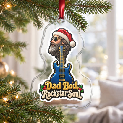 Dad Bod, Rockstar Soul Guitar clear acrylic Christmas ornament hanging on a Christmas tree by a bright window