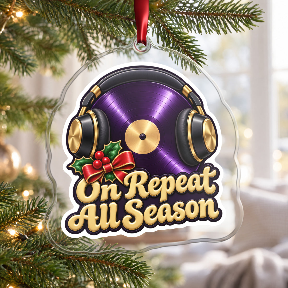 On Repeat Vinyl and Headphones clear acrylic Christmas ornament hanging on a Christmas tree by a bright window