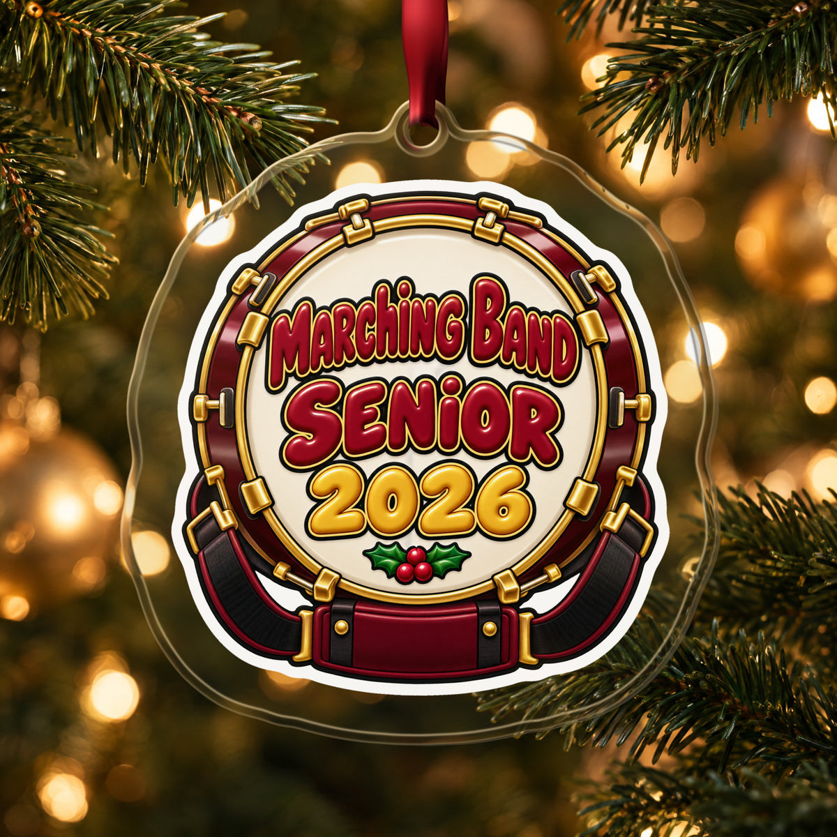Marching Band Senior 2026 clear acrylic Christmas ornament hanging on a lit Christmas tree with warm gold lights