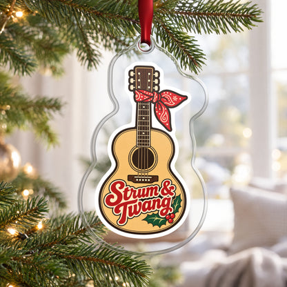Strum & Twang Country Guitar clear acrylic Christmas ornament hanging on a Christmas tree by a bright window