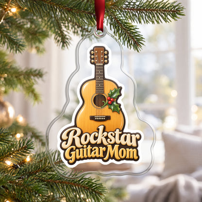 Rockstar Guitar Mom clear acrylic Christmas ornament hanging on a Christmas tree by a bright window