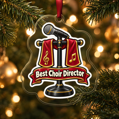 Best Choir Director clear acrylic Christmas ornament hanging on a lit Christmas tree with warm gold lights