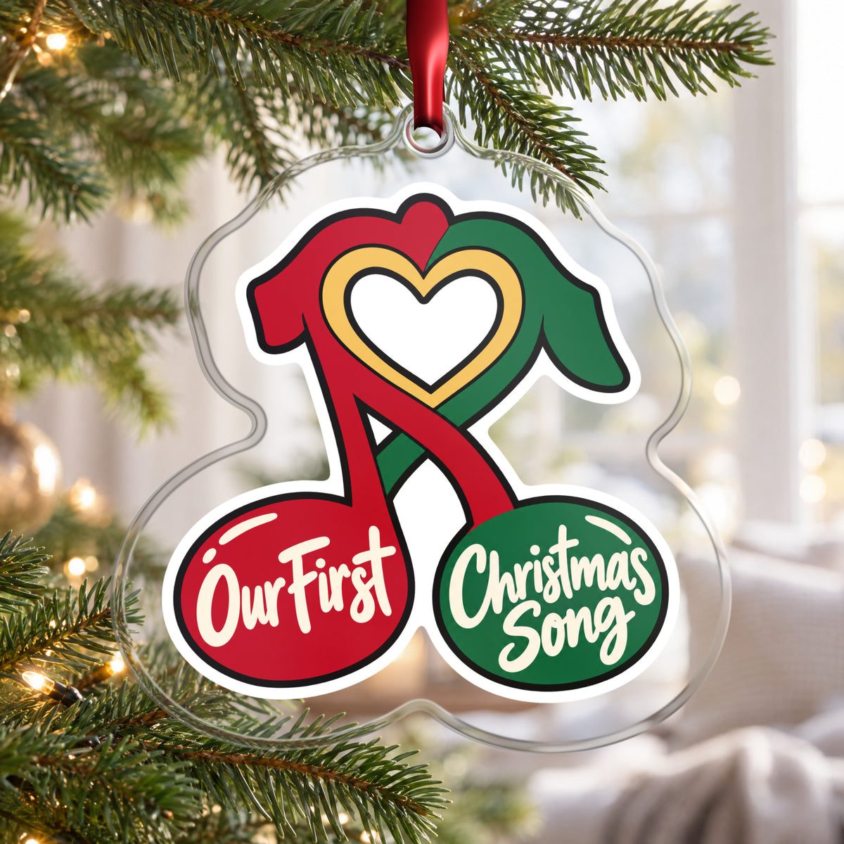 Our First Christmas Song Music Notes clear acrylic Christmas ornament hanging on a Christmas tree by a bright window