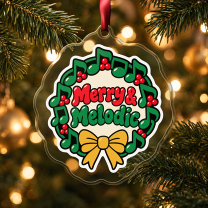 Merry & Melodic Music Note Wreath clear acrylic Christmas ornament hanging on a lit Christmas tree with warm gold lights