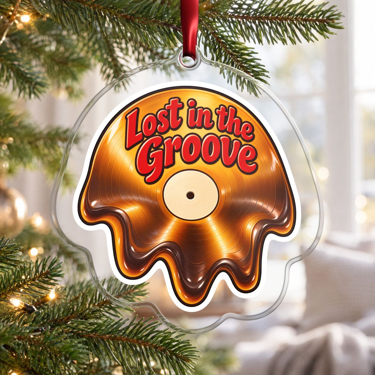 Lost in the Groove Melting Vinyl clear acrylic Christmas ornament hanging on a Christmas tree by a bright window
