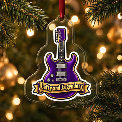 Lefty and Legendary Electric Guitar clear acrylic Christmas ornament hanging on a lit Christmas tree with warm gold lights
