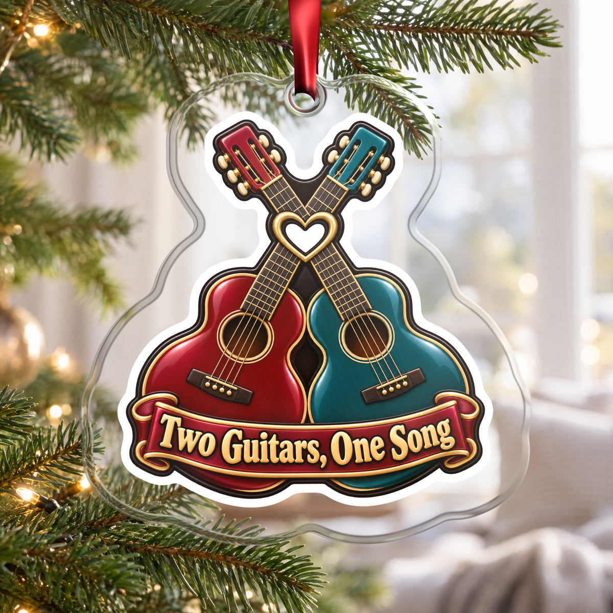 Two Guitars, One Song Couples clear acrylic Christmas ornament hanging on a Christmas tree by a bright window