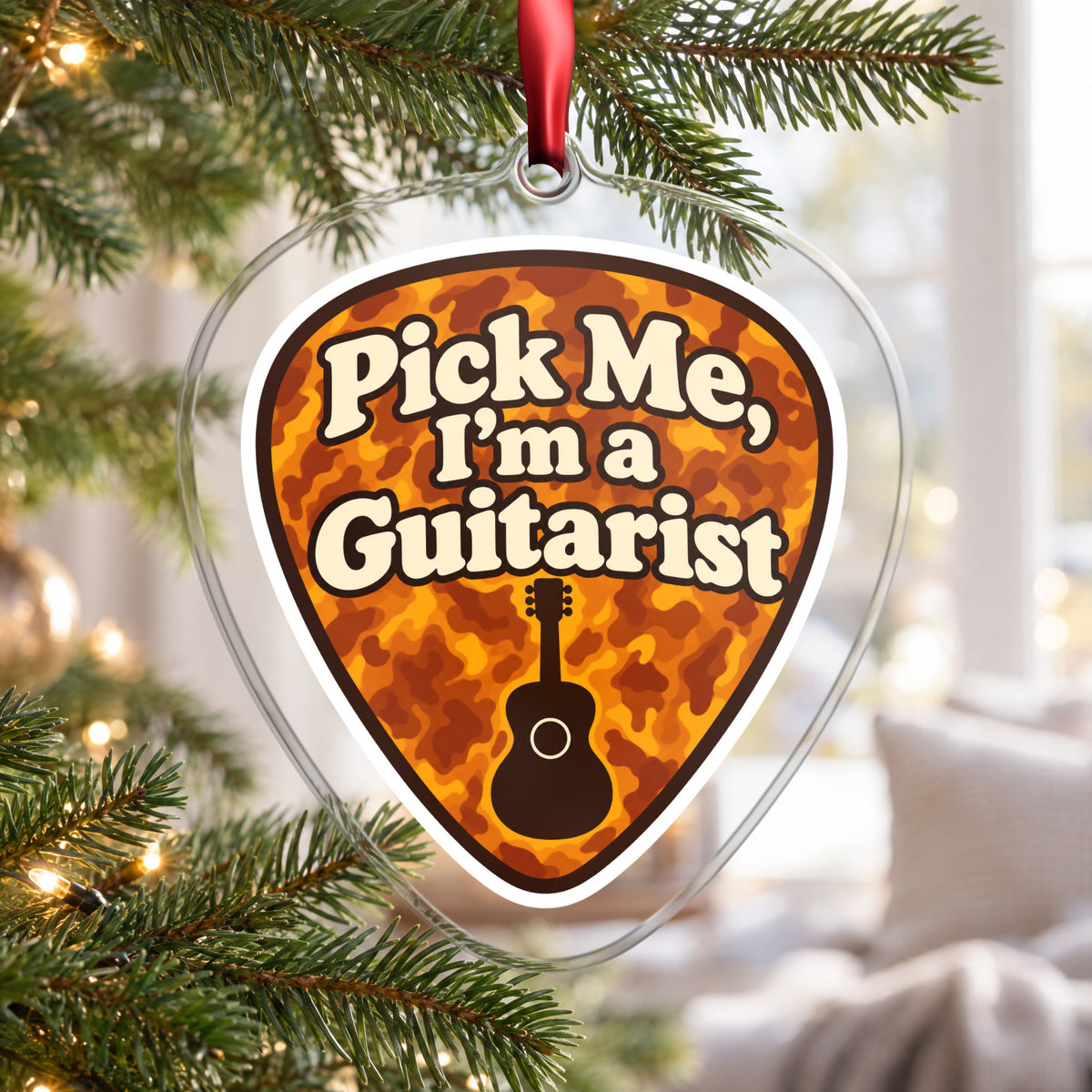 Pick Me, I'm a Guitarist Guitar Pick clear acrylic Christmas ornament hanging on a Christmas tree by a bright window