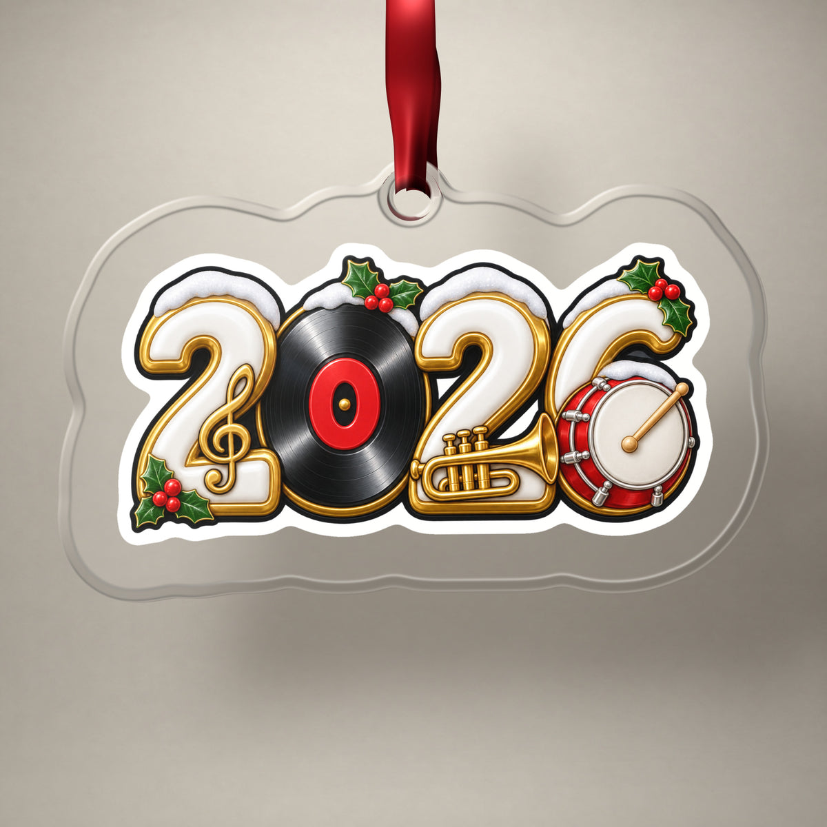 2026 Music Lover clear acrylic Christmas ornament on a plain studio backdrop with its red ribbon