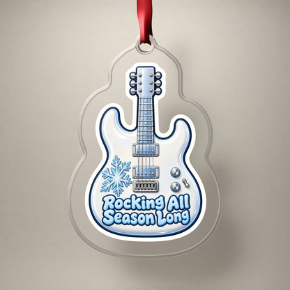 Rocking All Season Electric Guitar clear acrylic Christmas ornament on a plain studio backdrop with its red ribbon
