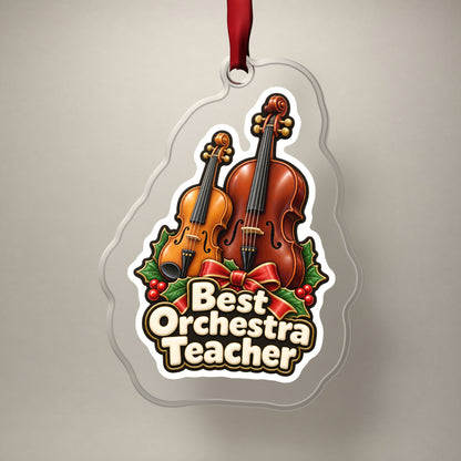 Best Orchestra Teacher clear acrylic Christmas ornament on a plain studio backdrop with its red ribbon