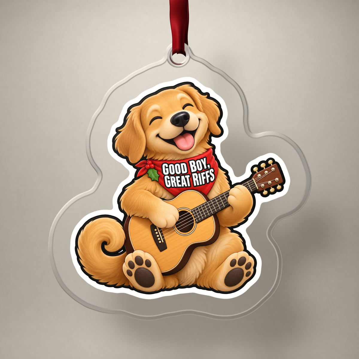 Good Boy, Great Riffs Dog Guitar clear acrylic Christmas ornament on a plain studio backdrop with its red ribbon