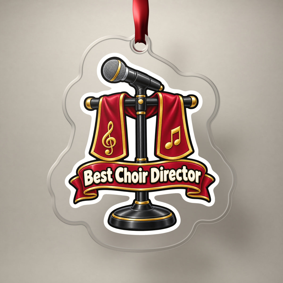Best Choir Director clear acrylic Christmas ornament on a plain studio backdrop with its red ribbon