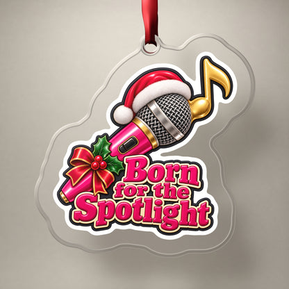 Born for the Spotlight Karaoke Mic clear acrylic Christmas ornament on a plain studio backdrop with its red ribbon