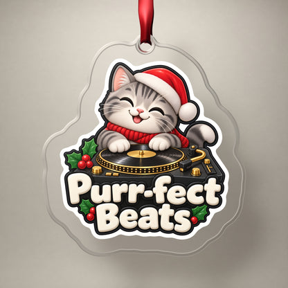 Purr-fect Beats Cat DJ clear acrylic Christmas ornament on a plain studio backdrop with its red ribbon