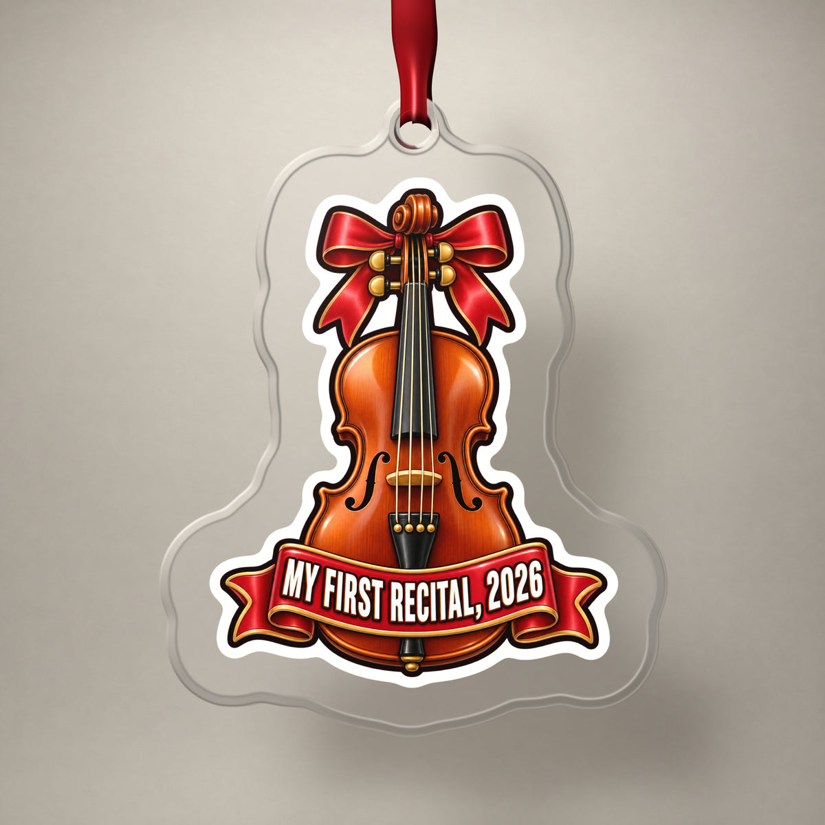 My First Violin Recital 2026 clear acrylic Christmas ornament on a plain studio backdrop with its red ribbon
