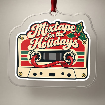 Mixtape for the Holidays Cassette clear acrylic Christmas ornament on a plain studio backdrop with its red ribbon
