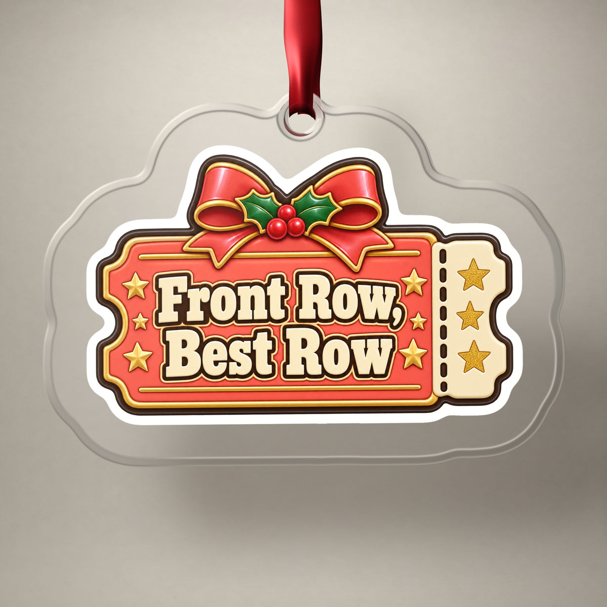 Front Row, Best Row Concert Ticket clear acrylic Christmas ornament on a plain studio backdrop with its red ribbon