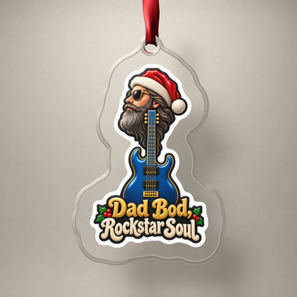 Dad Bod, Rockstar Soul Guitar clear acrylic Christmas ornament on a plain studio backdrop with its red ribbon