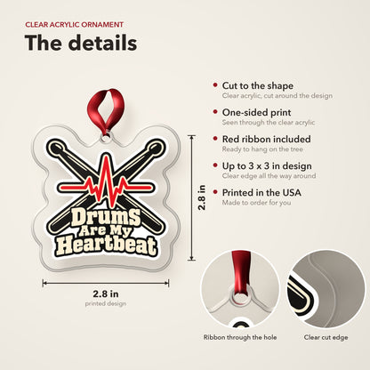 Drums Are My Heartbeat Drumsticks clear acrylic Christmas ornament details card: size, clear acrylic, ribbon included, printed in the USA