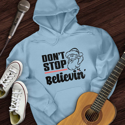Printify Hoodie Light Blue / S Don't Stop Believing Santa Hoodie
